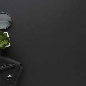 flat-lay-desktop-with-agenda-magnifying-glass